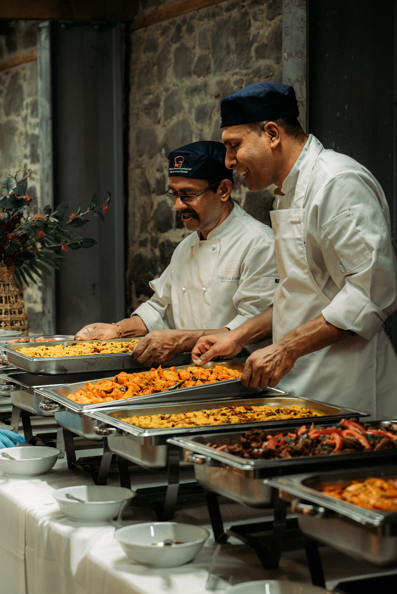 Pranitha Foods Catering chefs serving buffet dishes at an Auckland event